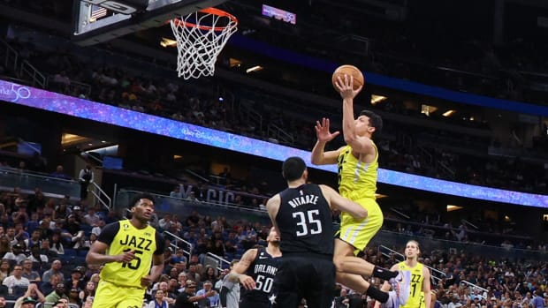 Utah Jazz forward Simone Fontecchio (16) drives to the hoop over Orlando Magic center Goga Bitadze (35) in the fourth quarter at Amway Center.